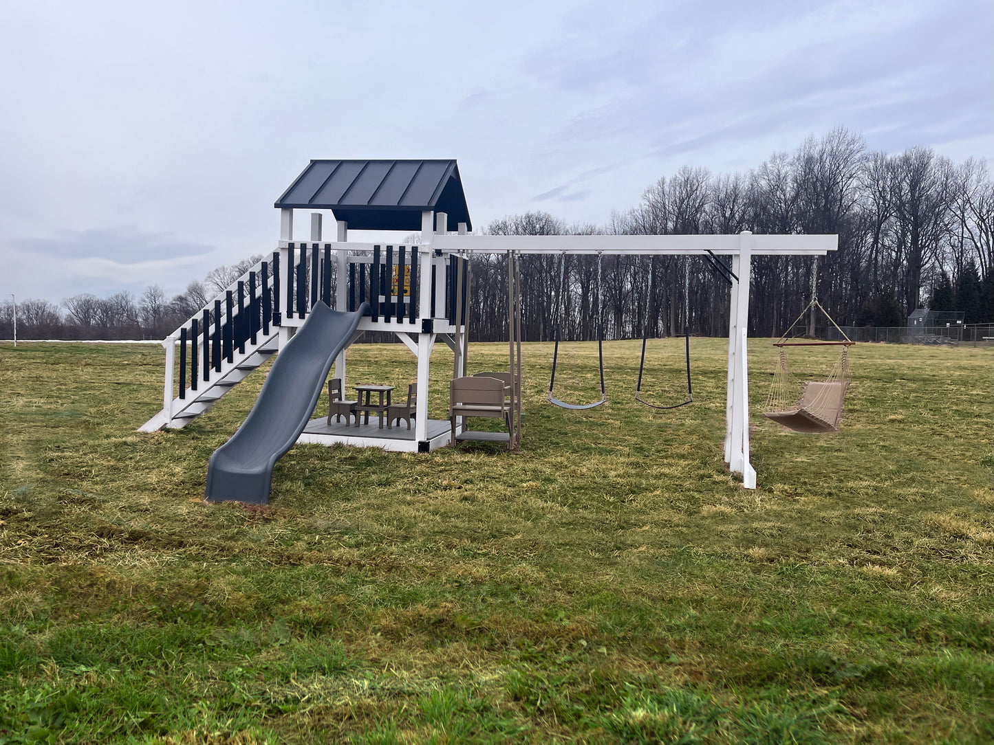 Amish Crafted Vinyl Swing Set | 3’x5′, 5′ Deck Height, 3-Position Single Beam | Trex Decking | Poly Spindles | Built To Last  | Premium Materials  | Weatherproof | Maintenance Free | No Splinters, Rust or Rot | 10 Year Warranty